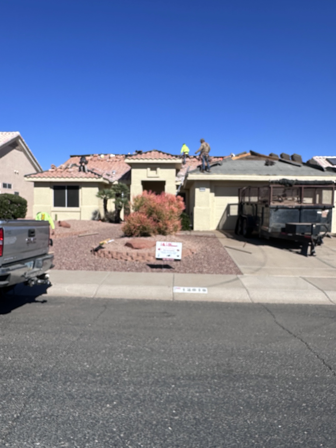 J&S roofing crew working on an Arizona tile roof